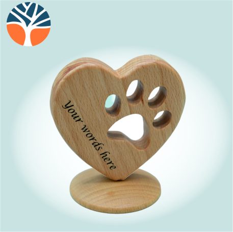 Wooden heart with paw print cut through.