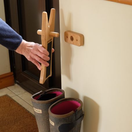 A wall mount to keep the boot jack off the floor.