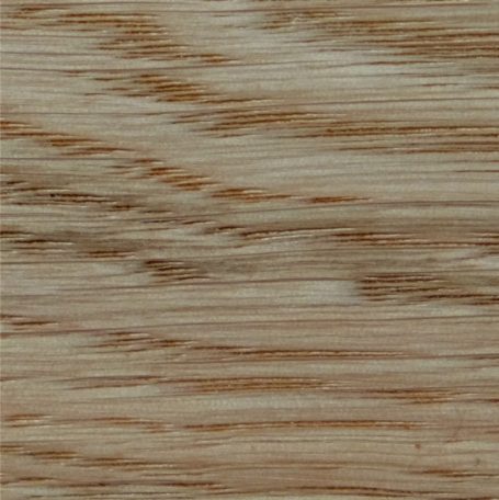 Light wooden surface with a subtle grain pattern and warm tones.