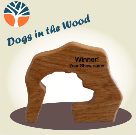 Wooden trophy cut from solid beech or oak with a silhouette of a dog's head cut through and engraved with your message.